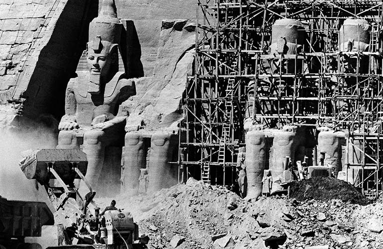 As time passed, the abandoned temple began to fill with sand. About the sixth century B.C., the sand covered the statues of the main temple up to the height of their knees. Abu Simbel was forgotten until 1813, when the Swiss Johann Ludwig Burckhardt visited him. As a result of the construction of the Aswan Dam in 1964, as Lake Nasser threatened to engulf the Temples of Abu Simbel, UNESCO cut them from the mountain and moved them to an artificial cliff 210 m (688ft) back from and 65 m (213 ft) above their original position.