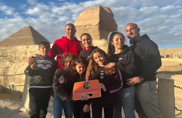 Family enjoying a guided tour of the Great Pyramids of Giza